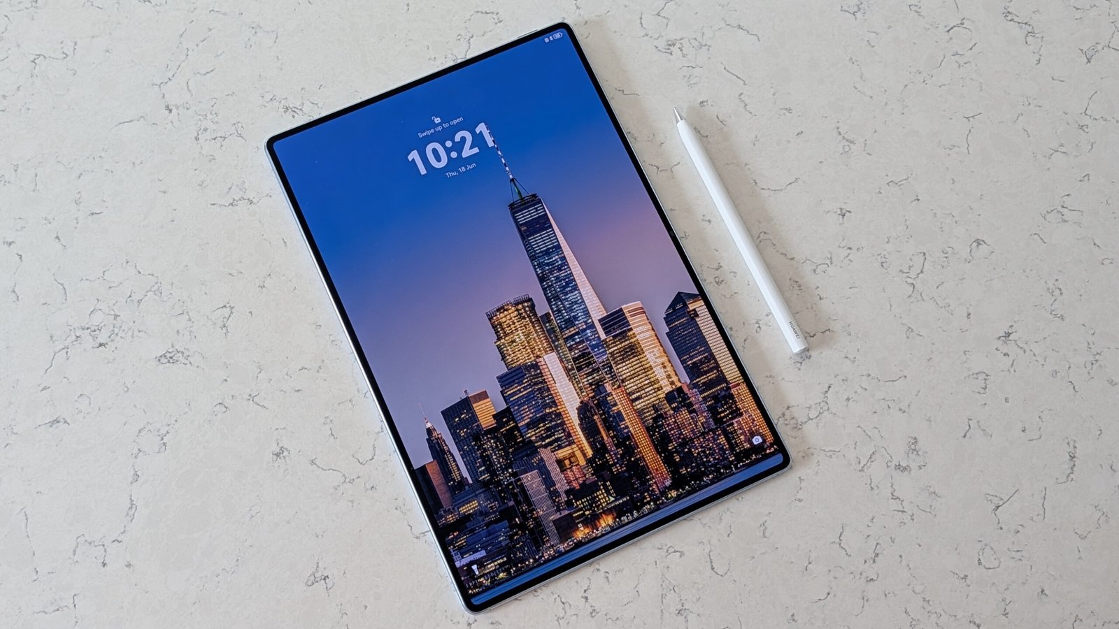Photos of the Huawei MatePad Pro Max resting on a marble table