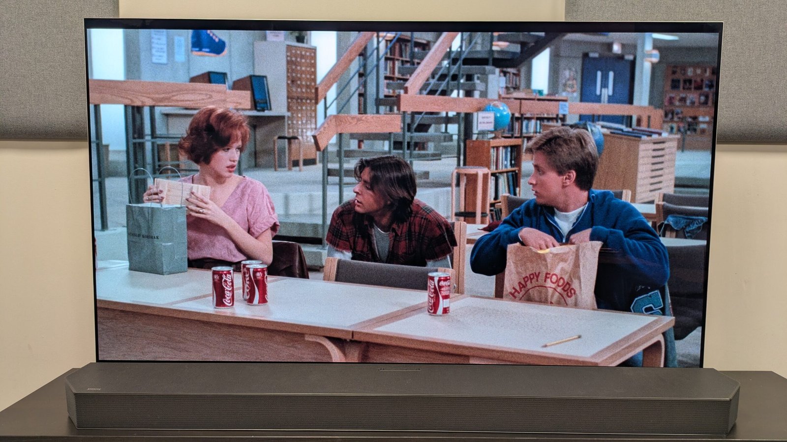 The Breakfast Club 4K Blu-ray on LG G5 OLED showing Claire, Andrew and Bender with coke cans and lunch