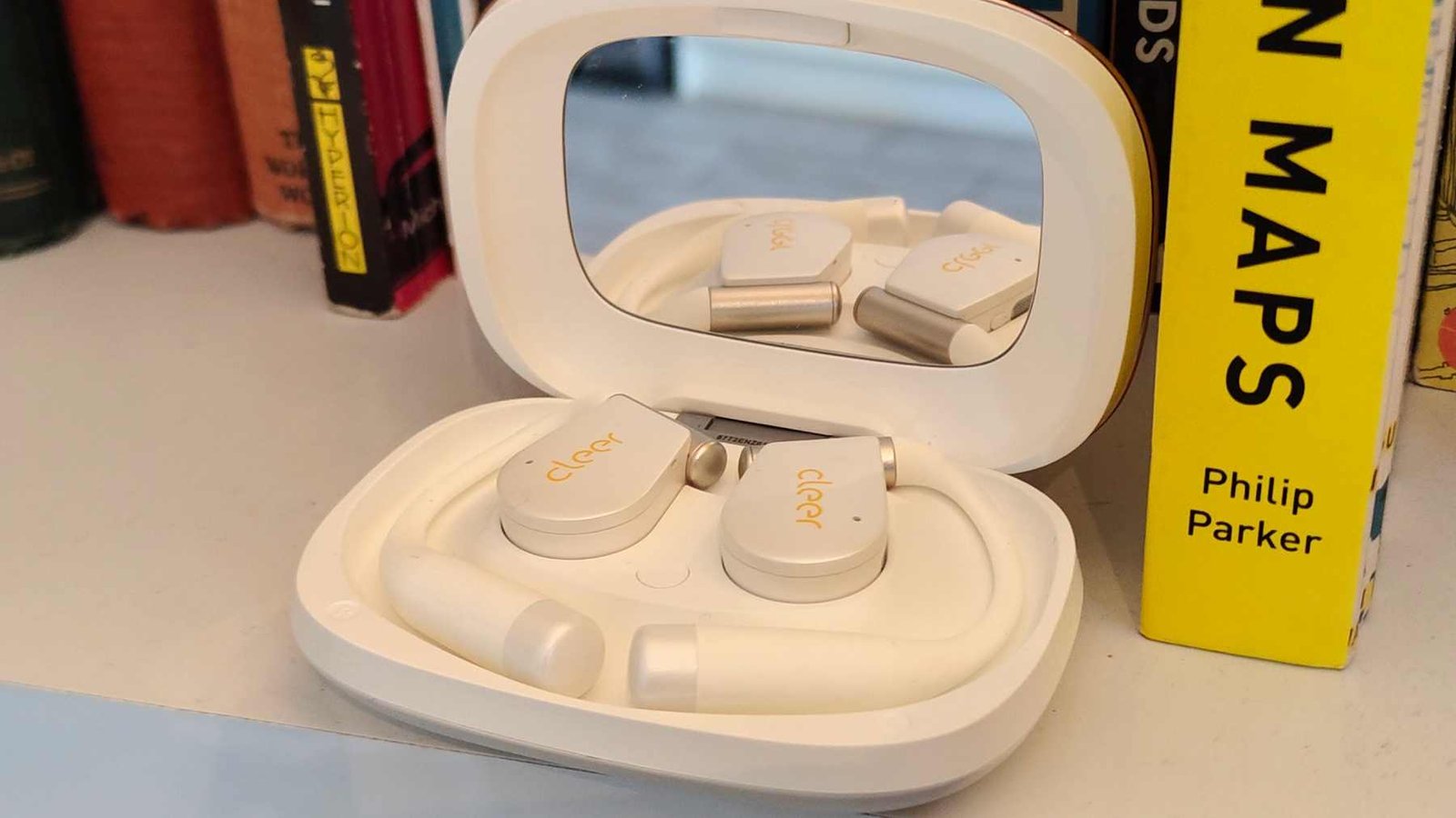The Cleer Arc 5 buds in their case.