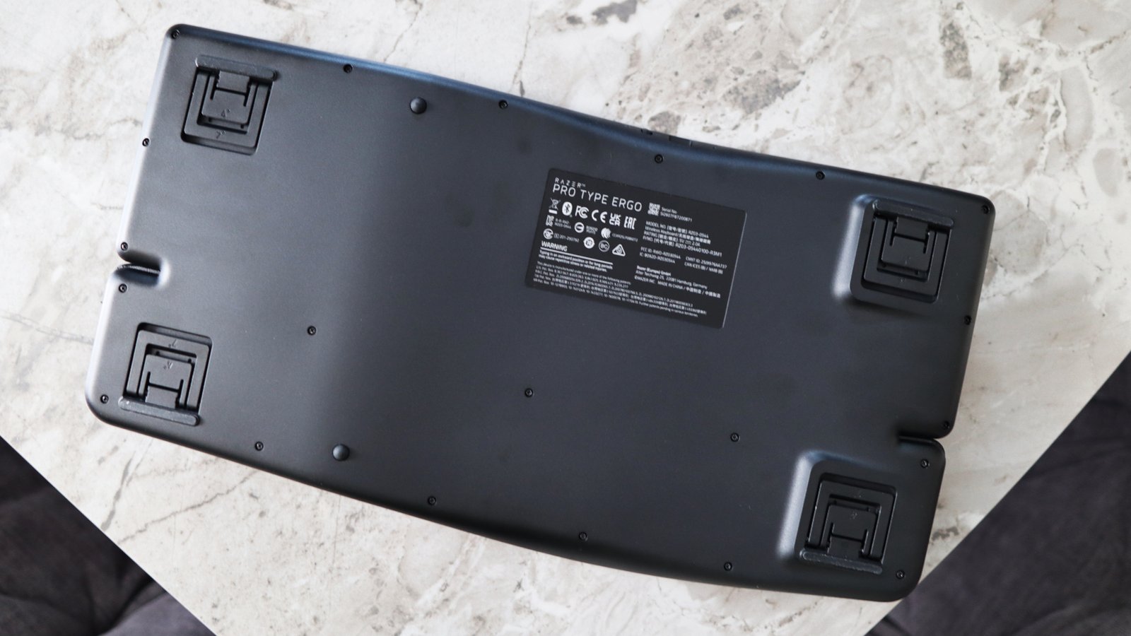 Razer Pro Type Ergo ergonomic keyboard on marble surface