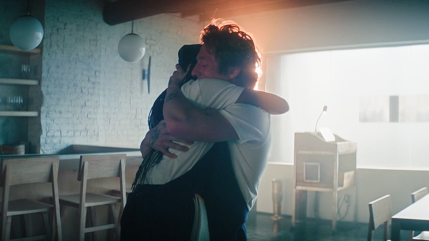 Sydney and Carmy hugging in the middle of the titular restaurant in The Bear season 5