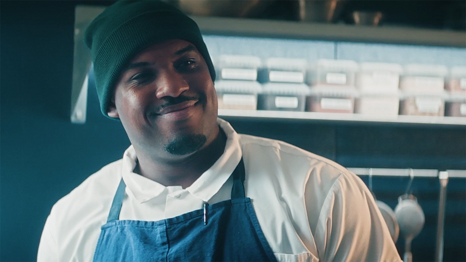 Marcus smiling at an off-camera Ebraheim in The Bear season 5