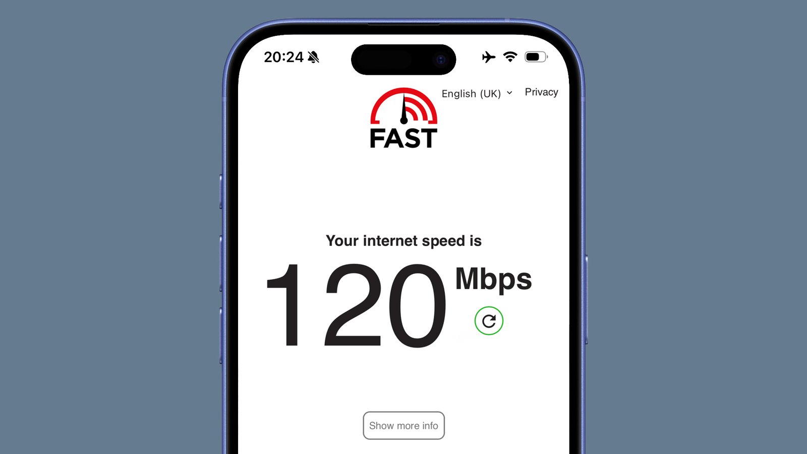 A phone on a grey background showing an internet speed check