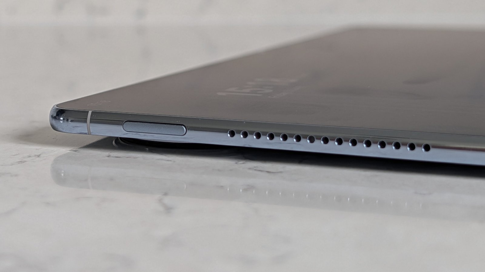 Photos of the Huawei MatePad Pro Max resting on a marble table