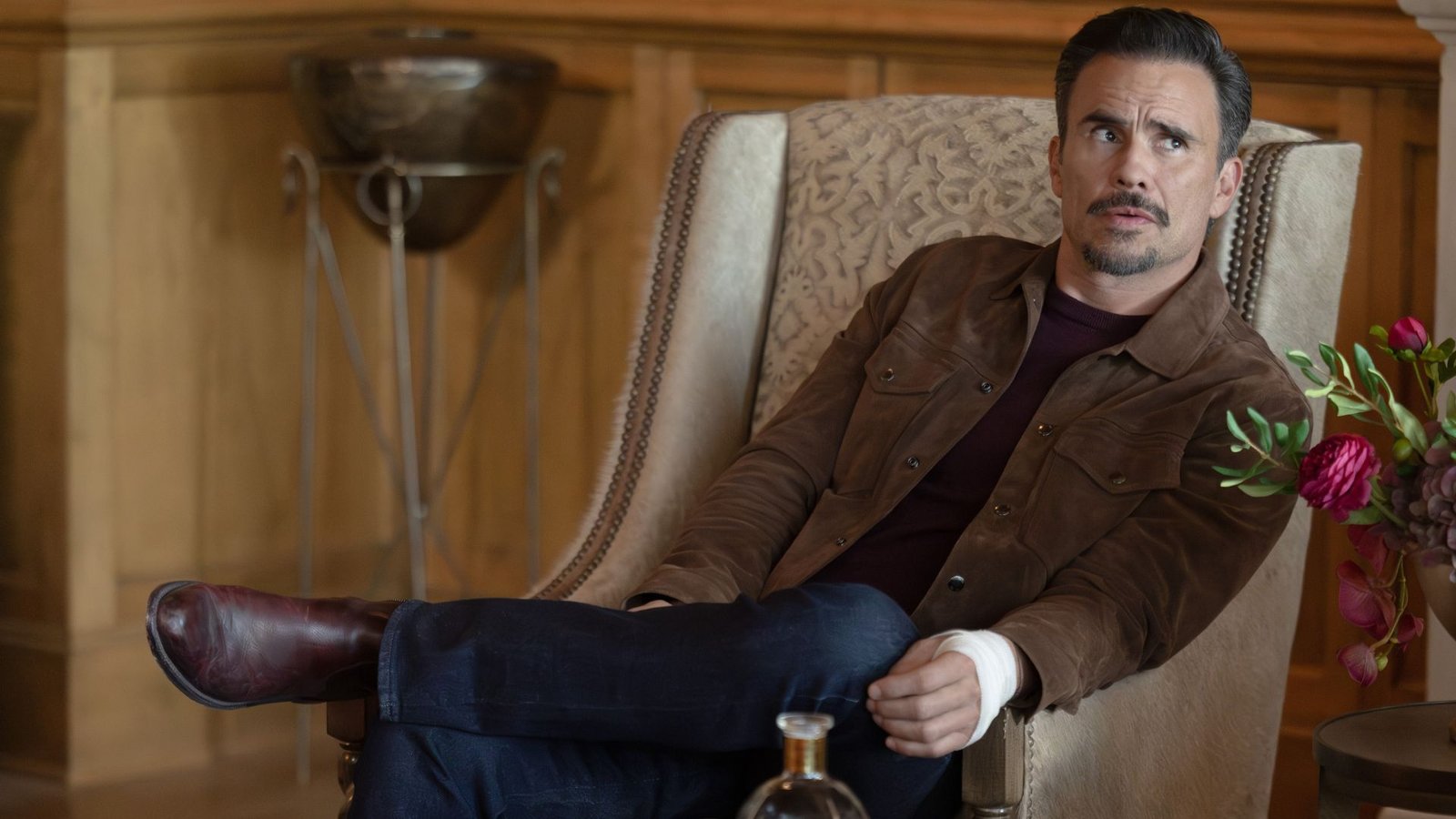 Joaquin sits in a chair