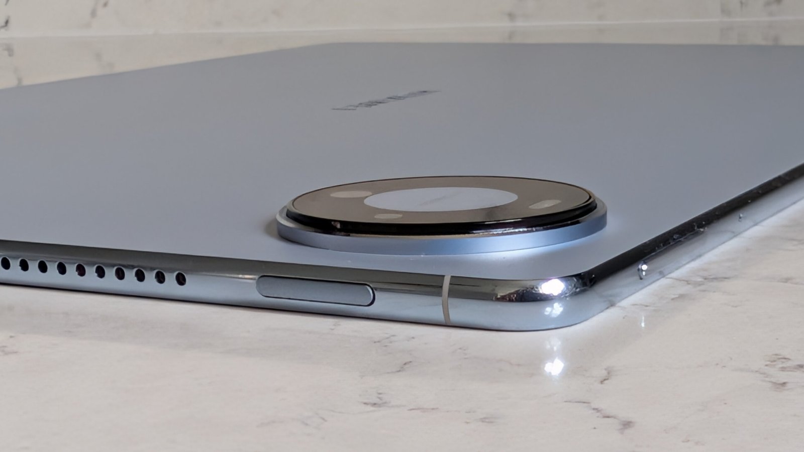 Photos of the Huawei MatePad Pro Max resting on a marble table