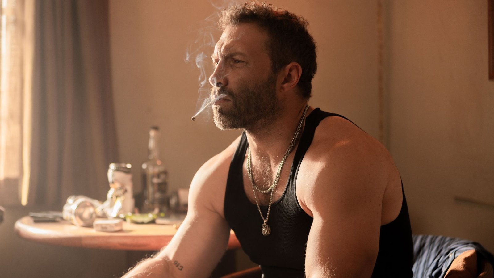 Rob-Will smokes a cigarette