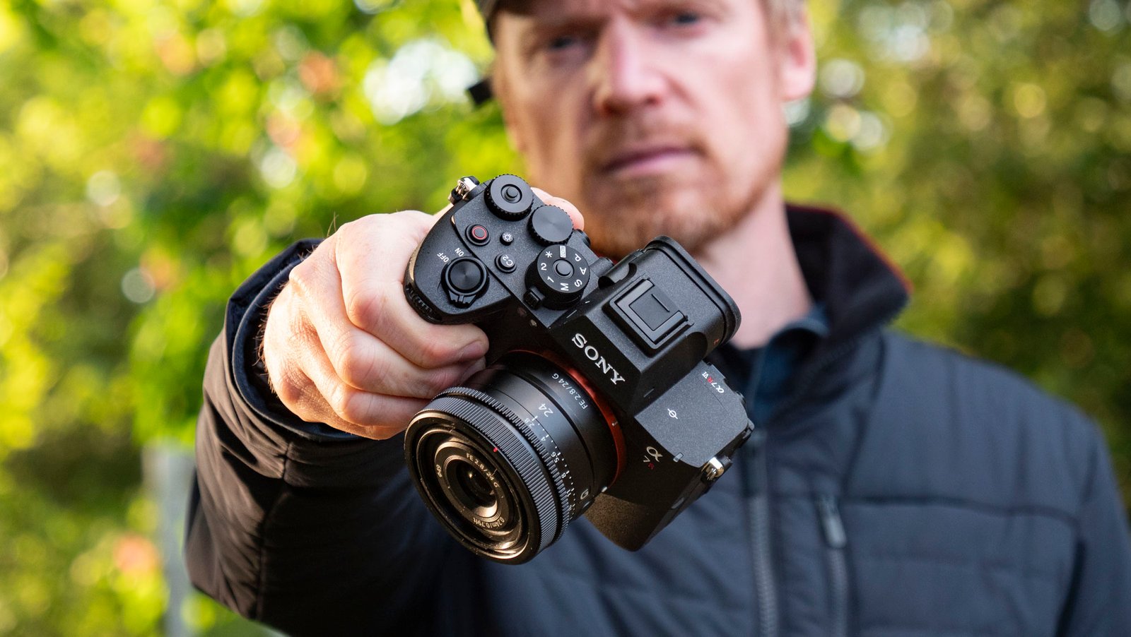 Sony A7R VI camera with 24mm F2.8 lens attached, in user's hands