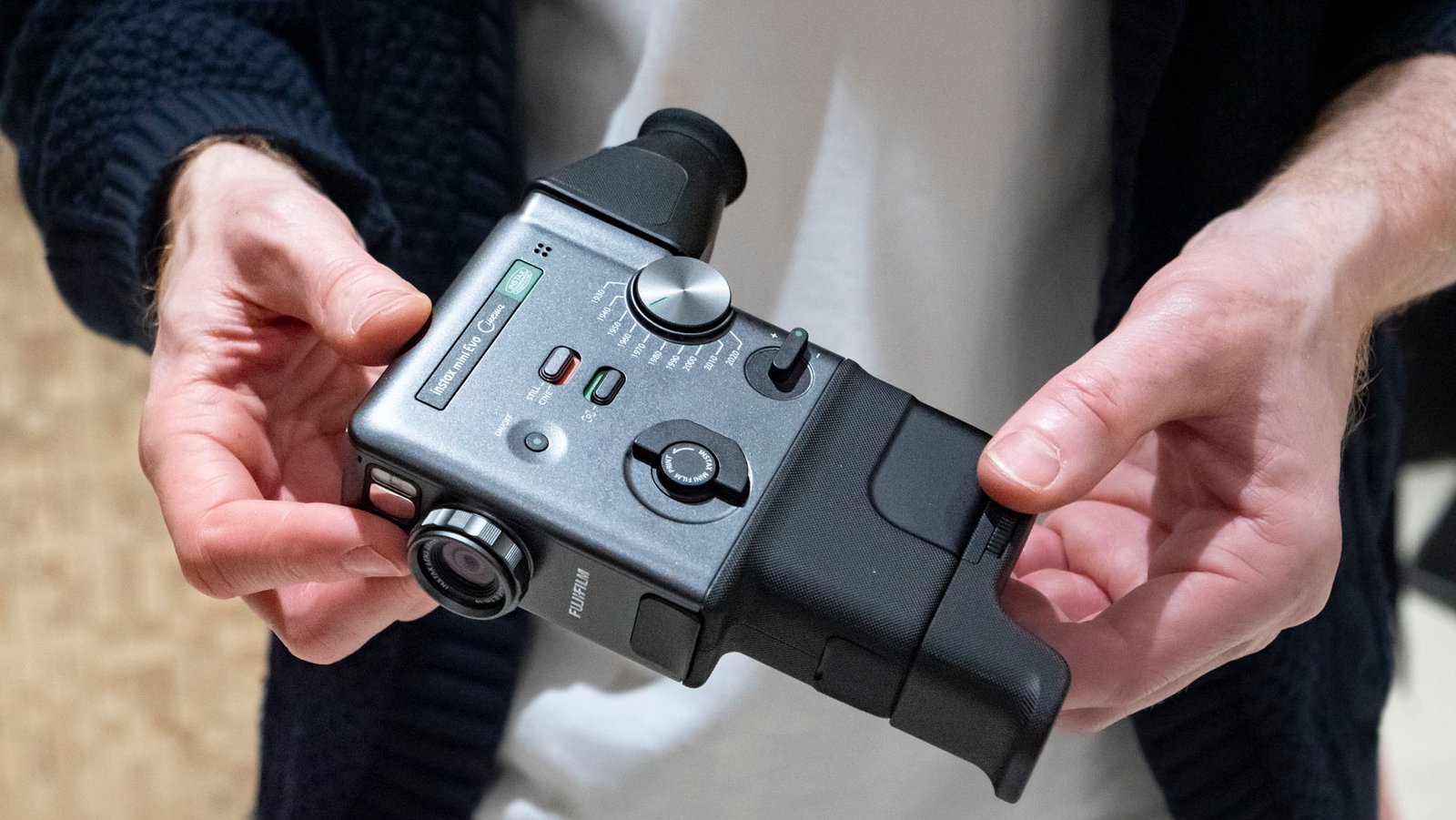 Fujifilm Instax Mini Evo Cinema camera in user's hands